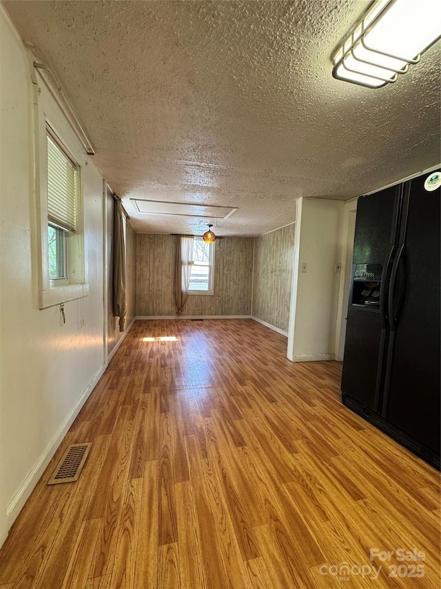 17 Jenny St, Asheville, NC 28806 - unfurnished room with wood finished floors, a textured ceiling, and baseboards