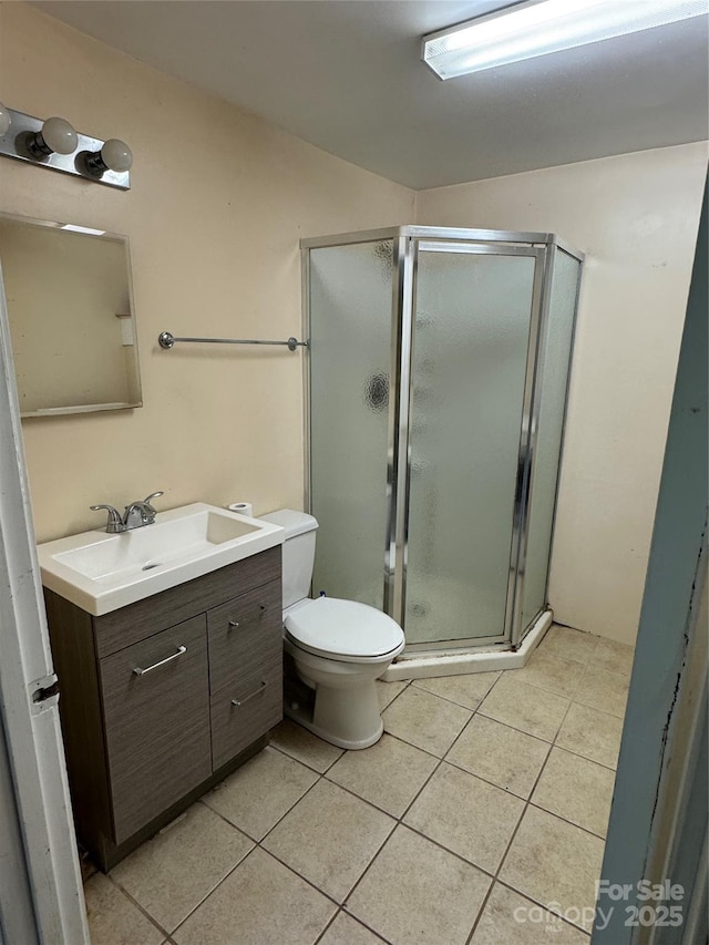 17 Jenny St, Asheville, NC 28806 - bathroom featuring vanity, tile patterned floors, a shower stall, and toilet