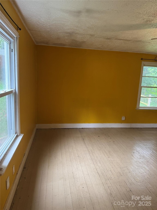 17 Jenny St, Asheville, NC 28806 - unfurnished room featuring hardwood / wood-style flooring, a textured ceiling, and baseboards