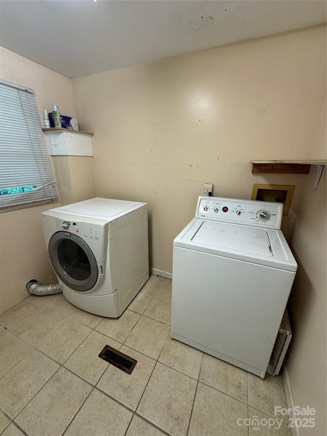 17 Jenny St, Asheville, NC 28806 - laundry room featuring separate washer and dryer and light tile patterned floors