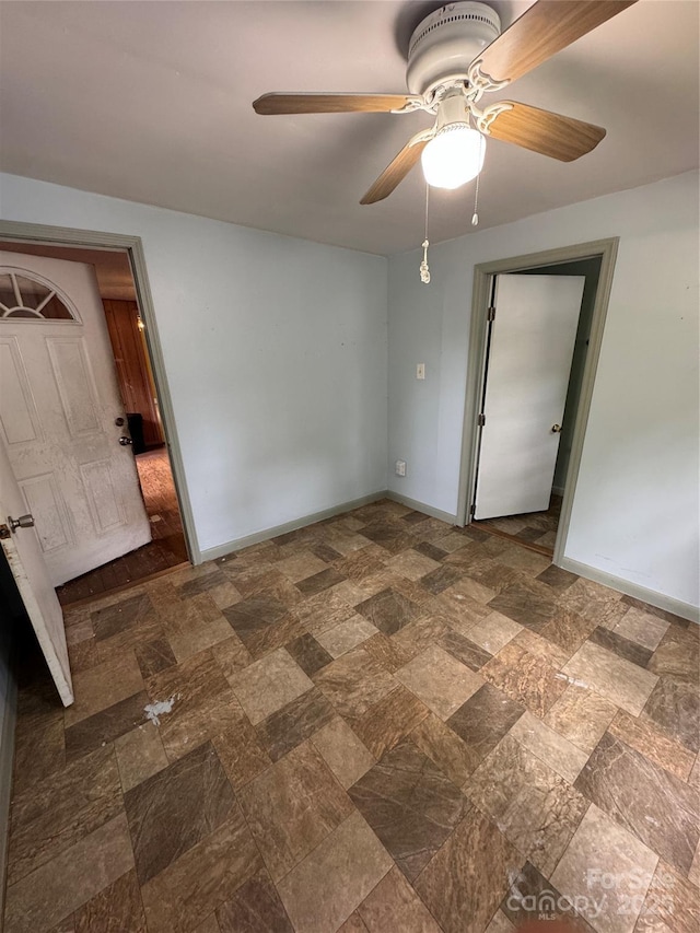 17 Jenny St, Asheville, NC 28806 - unfurnished room with baseboards, ceiling fan, and stone finish floors