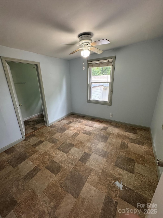 17 Jenny St, Asheville, NC 28806 - spare room featuring baseboards and a ceiling fan