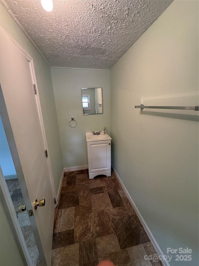 17 Jenny St, Asheville, NC 28806 - bathroom with vanity, baseboards, and a textured ceiling