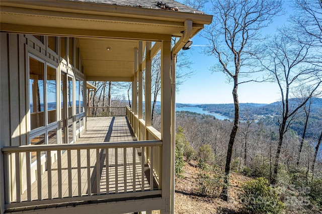 wooden deck featuring a water view