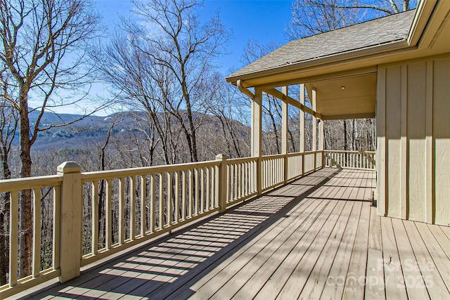 wooden deck with a mountain view