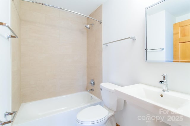 full bath featuring shower / bathtub combination, a sink, and toilet