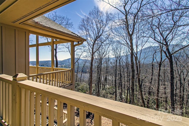 wooden deck with a mountain view