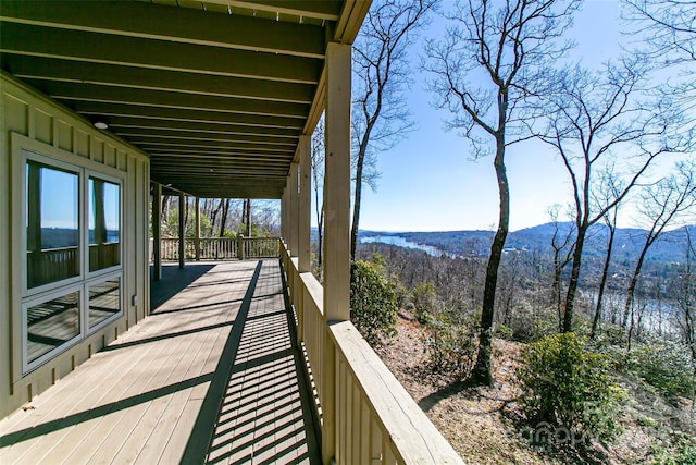 wooden deck with a mountain view