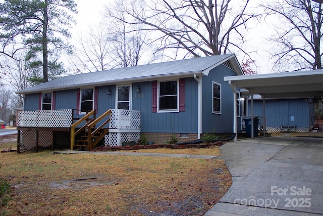 ranch-style house with a carport