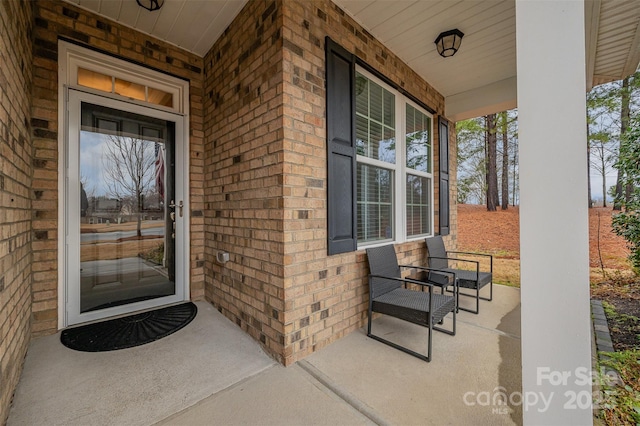 doorway to property with a porch