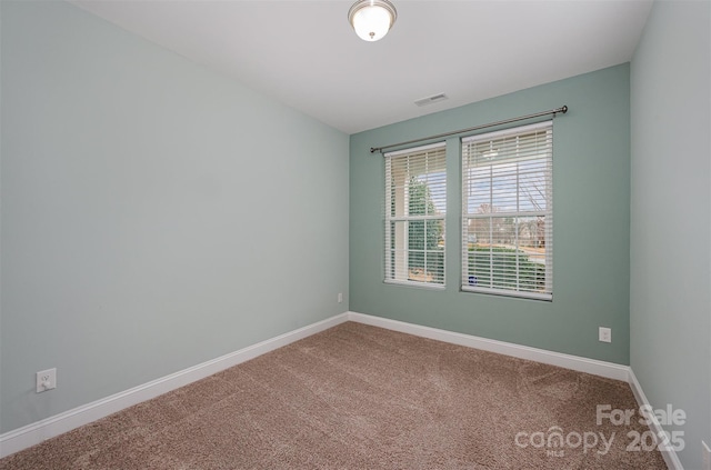 unfurnished room with carpet flooring