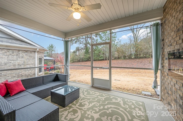 sunroom / solarium with ceiling fan