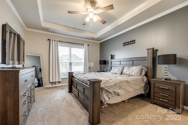 bedroom featuring a raised ceiling, light colored carpet, visible vents, ornamental molding, and baseboards