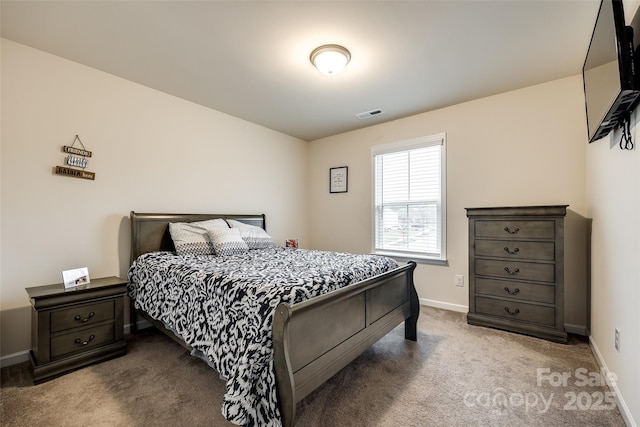 bedroom with carpet floors, visible vents, and baseboards