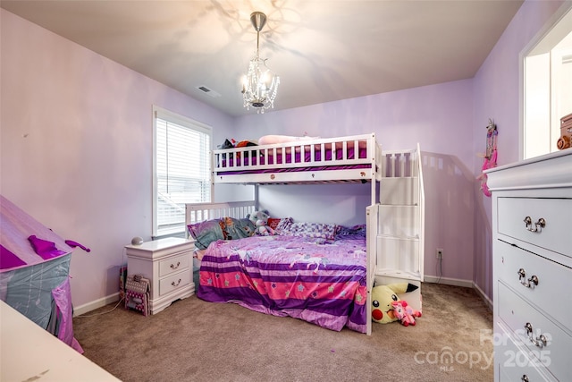 bedroom with baseboards, carpet flooring, visible vents, and an inviting chandelier