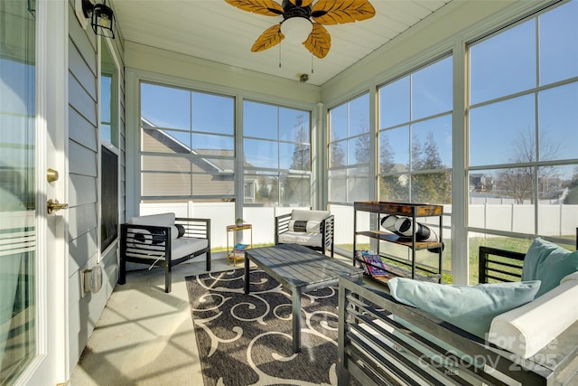 sunroom / solarium featuring ceiling fan