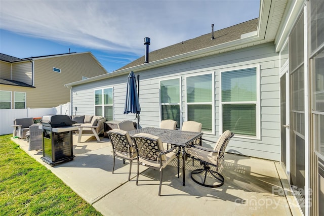 view of patio featuring outdoor dining space, fence, an outdoor living space, and area for grilling