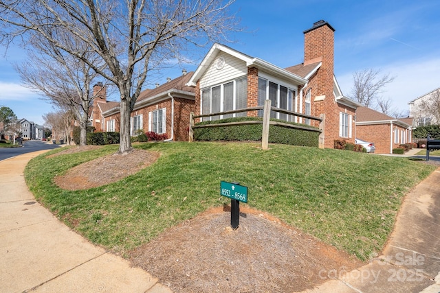 view of front of home with a front lawn