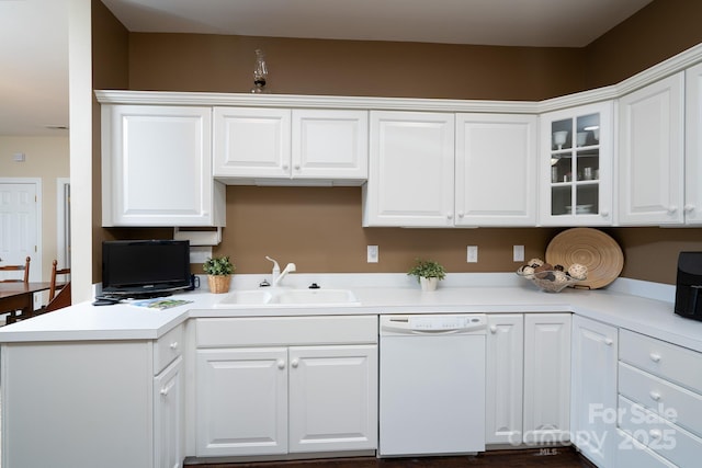 kitchen featuring white cabinets, dishwasher, and sink