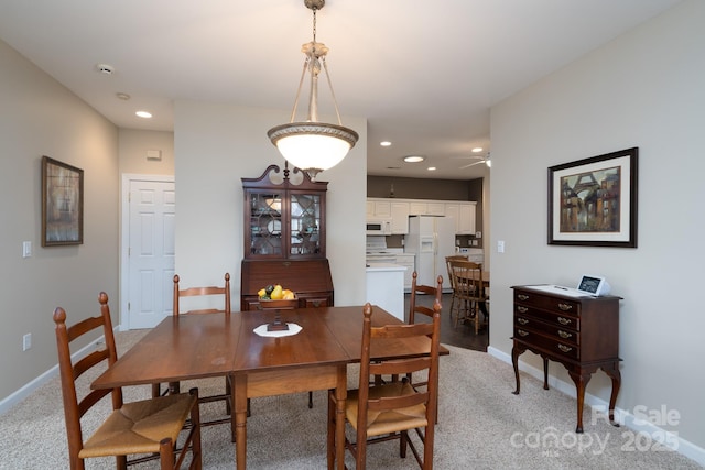 view of carpeted dining space