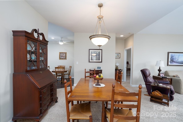 dining room with light colored carpet