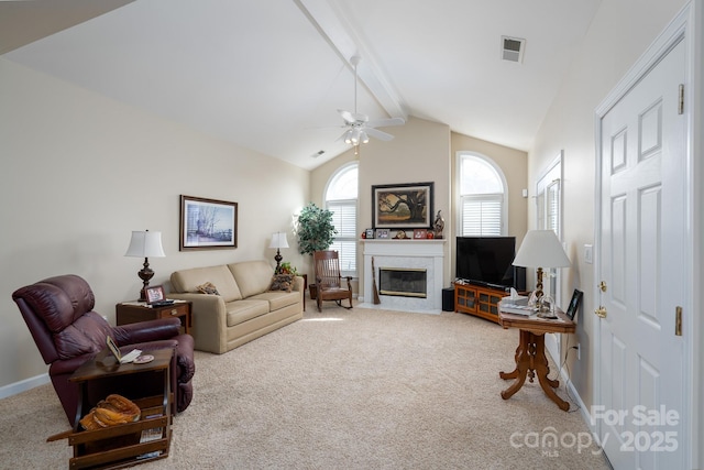 living room with high vaulted ceiling, beamed ceiling, carpet flooring, and ceiling fan