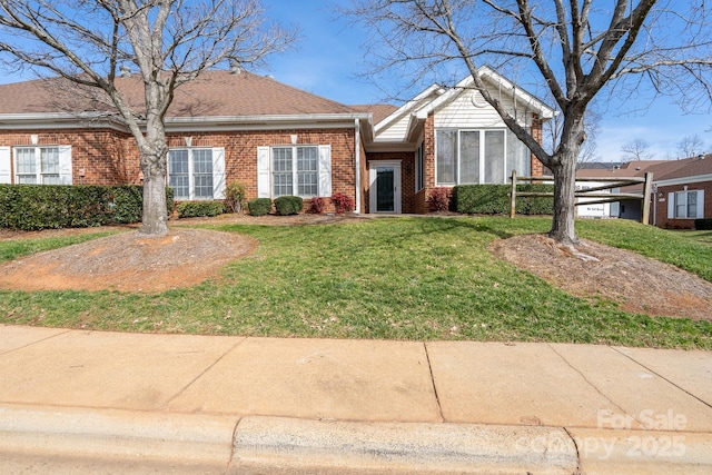 ranch-style house with a front lawn