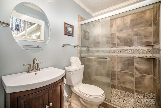 bathroom with a shower with door, toilet, a textured ceiling, vanity, and crown molding