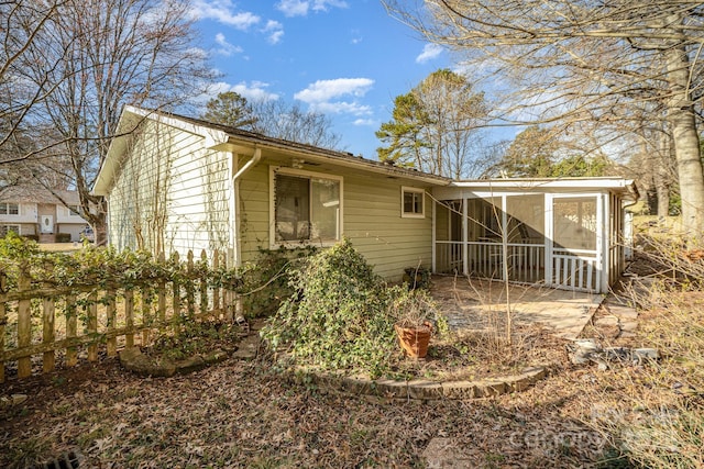 back of house with a sunroom