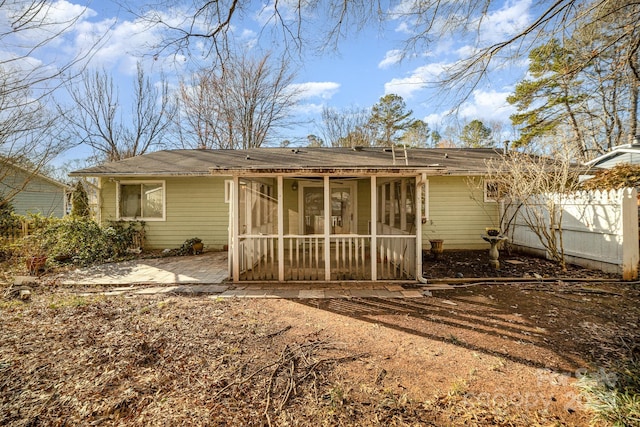 back of house with a patio and a sunroom