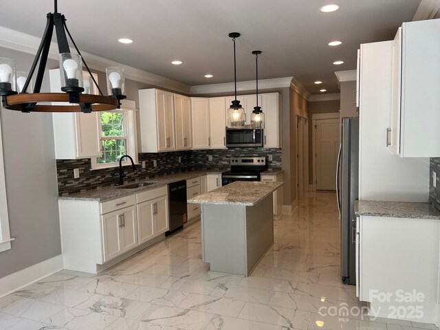 7221 Static Way Unit 13, Sherrills Ford, NC 28673 - kitchen featuring stainless steel appliances, a sink, ornamental molding, baseboards, and a kitchen island