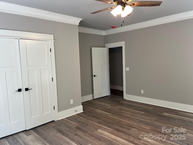 7221 Static Way Unit 13, Sherrills Ford, NC 28673 - unfurnished bedroom featuring dark wood finished floors, baseboards, crown molding, a ceiling fan, and a closet