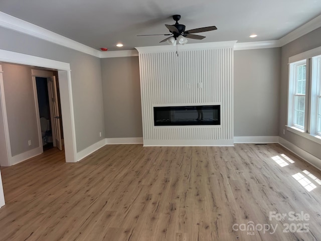 7221 Static Way Unit 13, Sherrills Ford, NC 28673 - unfurnished living room featuring crown molding, light wood-style floors, baseboards, and recessed lighting