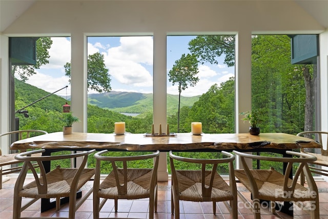 sunroom featuring a mountain view