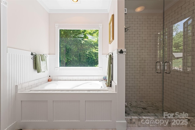 bathroom with a wealth of natural light, a stall shower, a garden tub, and crown molding