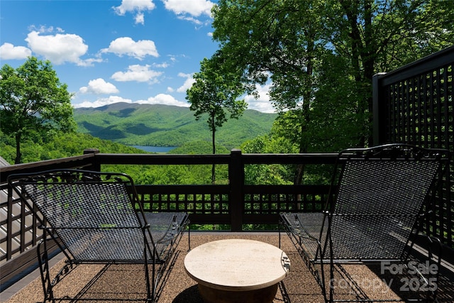 wooden deck featuring a mountain view