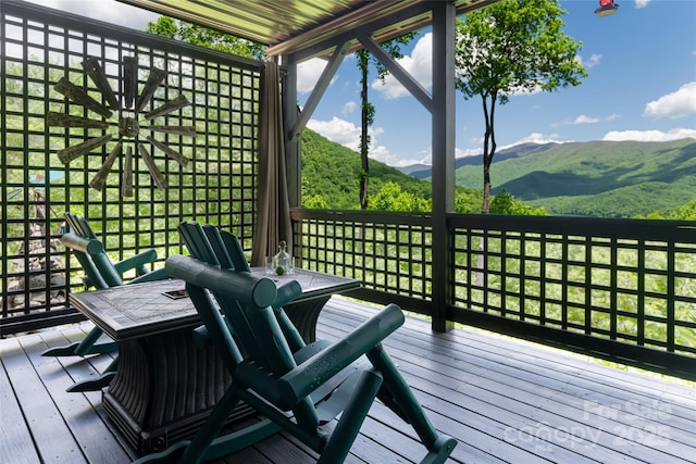 wooden terrace featuring a mountain view