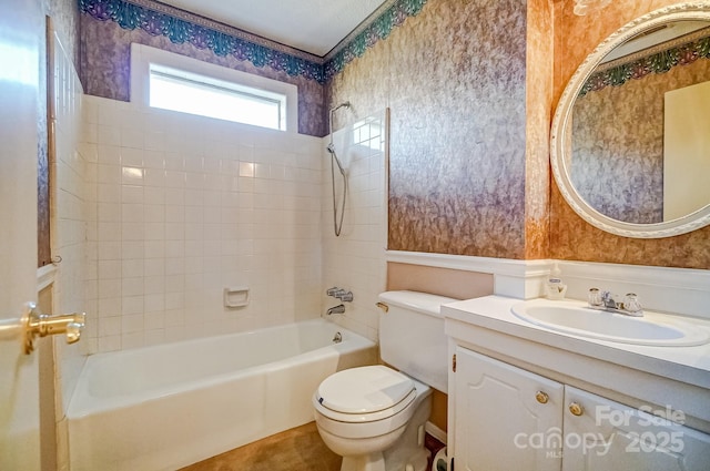 full bath with wallpapered walls, shower / bathing tub combination, toilet, and vanity