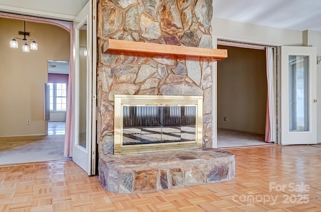 interior details featuring a stone fireplace