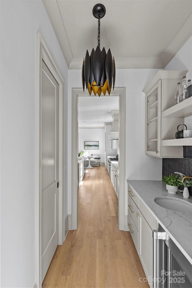 interior space featuring sink and light hardwood / wood-style floors