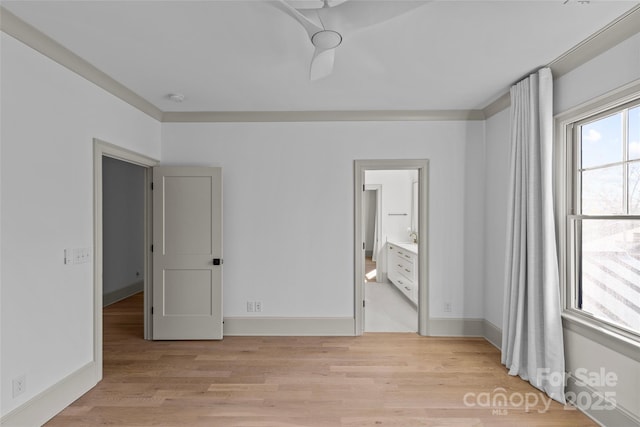 unfurnished bedroom featuring ensuite bathroom, ceiling fan, and light hardwood / wood-style floors