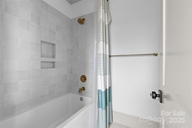 bathroom with shower / tub combo