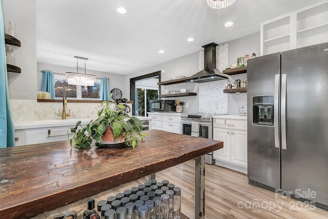 kitchen with range hood, open shelves, appliances with stainless steel finishes, white cabinetry, and a wealth of natural light