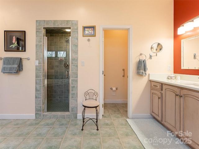 bathroom featuring vanity, tile patterned floors, and walk in shower