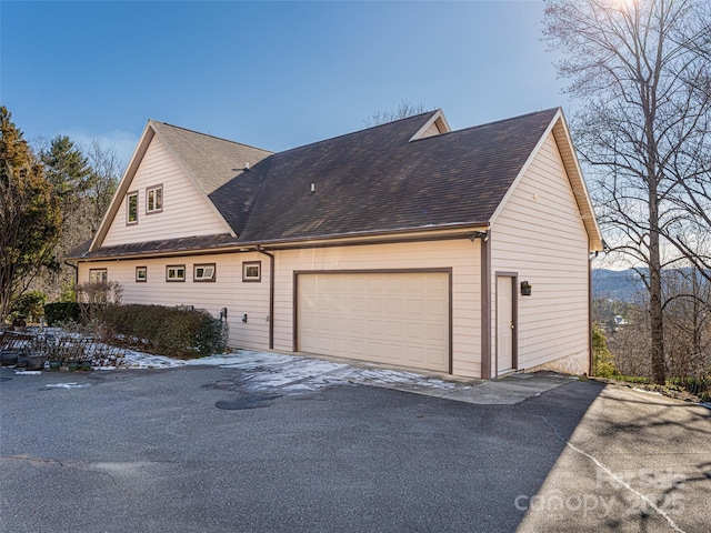 view of home's exterior featuring a garage