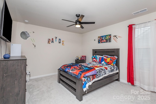 bedroom featuring light colored carpet, visible vents, ceiling fan, and baseboards