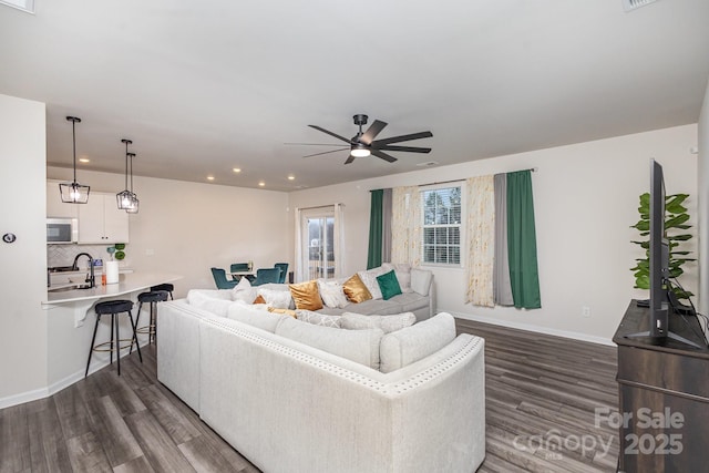 living room with ceiling fan, baseboards, dark wood-type flooring, and recessed lighting