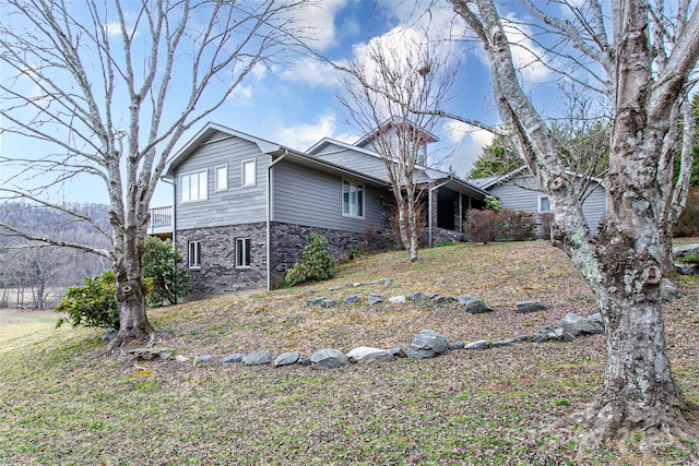 exterior space featuring stone siding