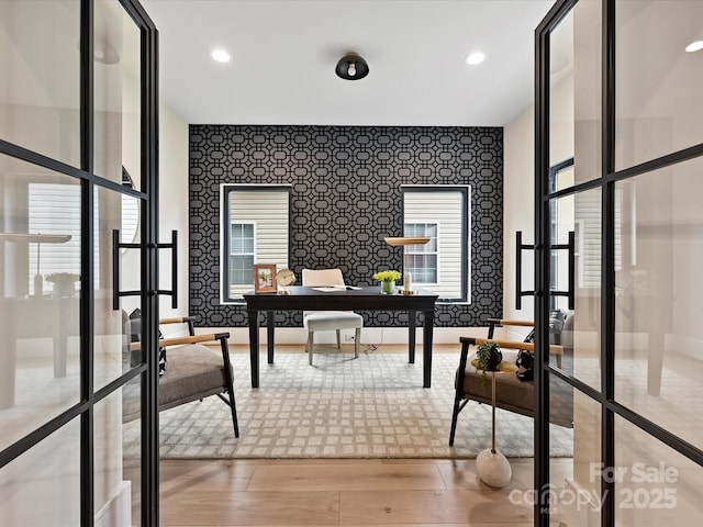 office area with wallpapered walls, recessed lighting, and french doors