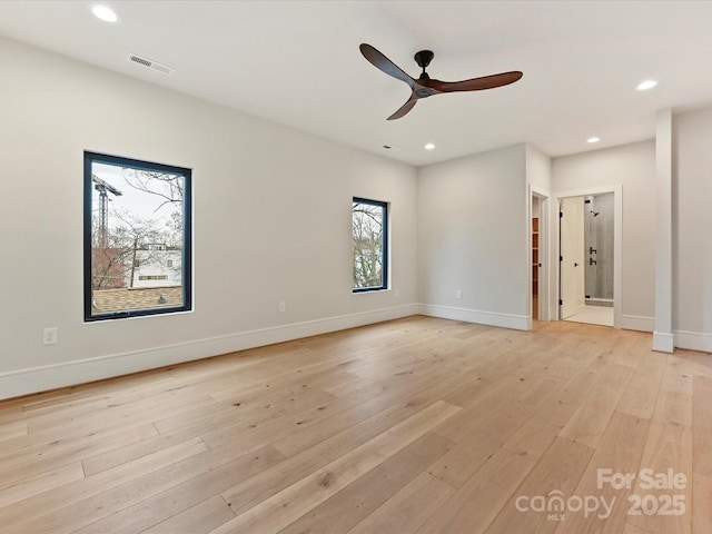 spare room featuring visible vents, recessed lighting, light wood-type flooring, and baseboards